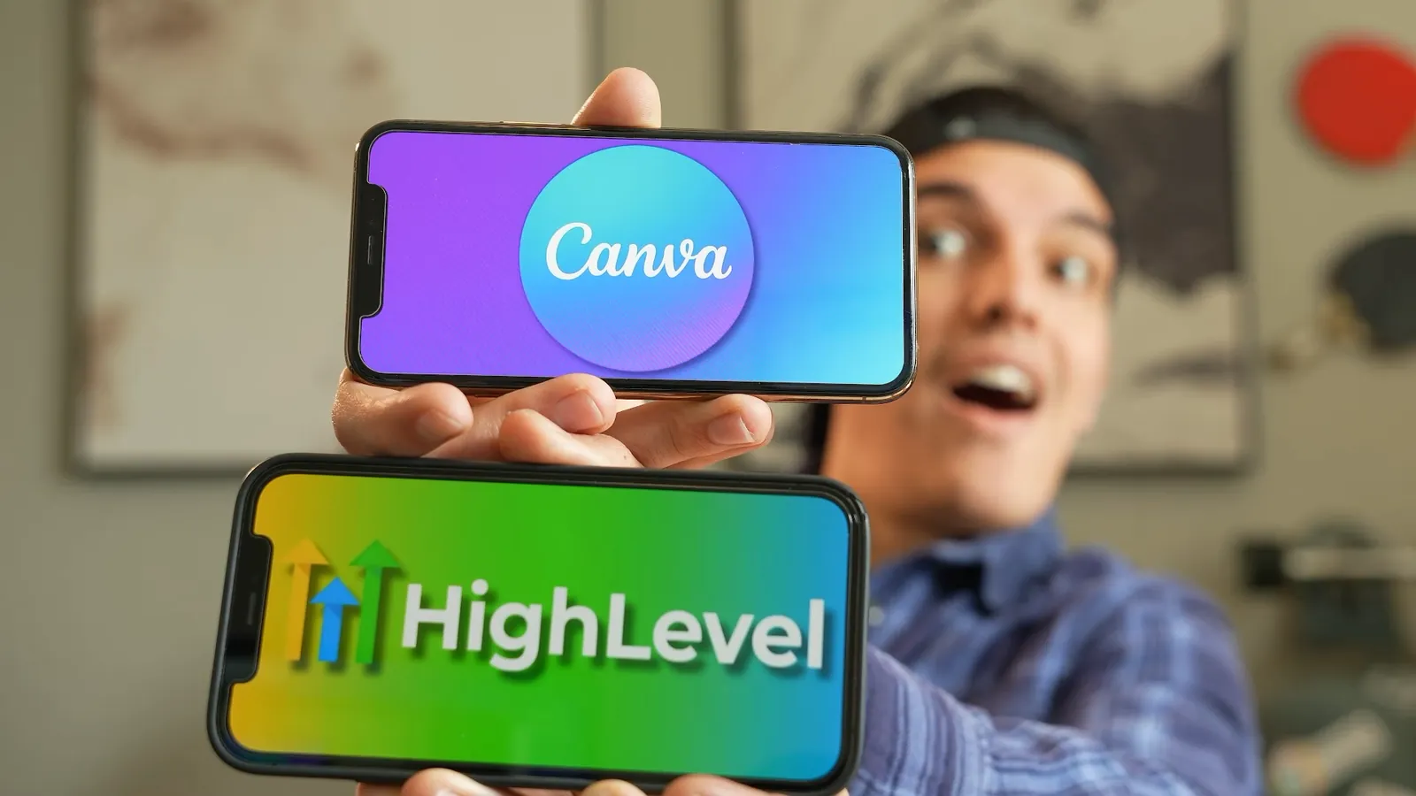 Joshua holding phones showing Canva and HighLevel branding