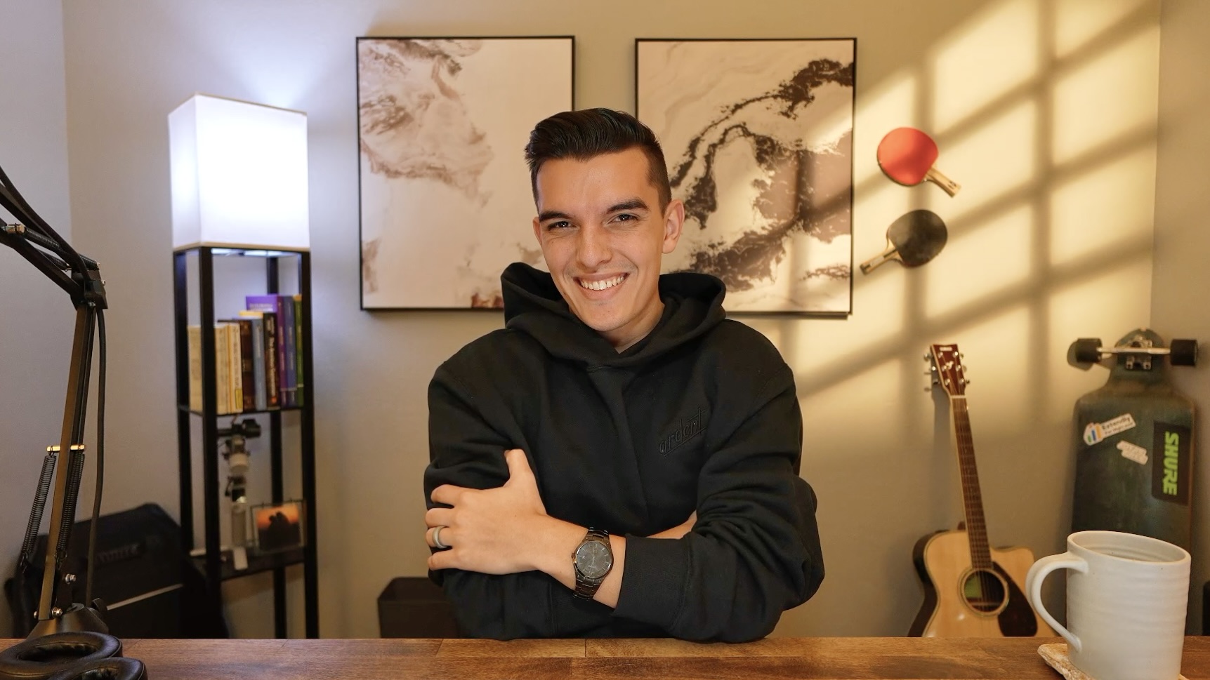 Joshua smiling at his desk